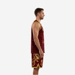 Front view of custom maroon and gold basketball uniform with V-neck gold binding and fire-effect number on deep crimson scale-pattern jersey