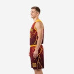 Opposite side view of custom maroon and gold basketball uniform showing lightning sublimation print flowing from jersey into shorts