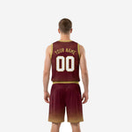 Second side view of custom maroon and gold sublimated basketball jersey and shorts showing halftone dot fade detail on shorts hem