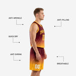 Detail view of gold gradient basketball shorts with player number 00 on lower left leg and elasticated waistband