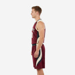 Side view of the maroon and gold basketball uniform set showing curved black and cream side panels on jersey and shorts