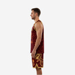 Side view of maroon and gold basketball uniform showing sleeveless jersey profile and matching shorts with gold hem trim and side split