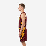 Side view of maroon and gold basketball team uniform showing full gold and black lightning bolt graphic running down jersey and shorts side panel