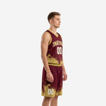 Side view of maroon and gold sublimated basketball uniform set showing gold armhole binding and splash pattern on jersey and shorts