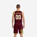 Side view of the maroon reversible basketball jersey showing the gold brush-stroke panel at the shoulder and bound armhole edge