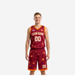 Maroon and gold reversible basketball uniforms with starburst geometric pattern, V-neck jersey, and matching shorts shown from the front on a male model