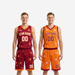 Full set view of the maroon and gold reversible basketball uniforms laid flat showing both the maroon side and orange reverse side of the jersey