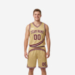 Gold side of the maroon and gold reversible basketball uniform showing gold jersey with maroon diagonal swoosh stripe team name and number 00 on adult male model
