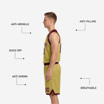 Close-up detail of the gold and maroon reversible basketball shorts showing brush-stroke panel on the outer leg and front number placement