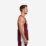Adult male wearing custom maroon and yellow basketball jersey with gold trim binding at crew neckline and white side panels - front view
