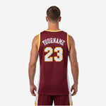 Opposite side view of the maroon and yellow basketball jersey showing the athletic cut and gold armhole binding detail at the shoulder