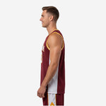 Side view of the custom maroon and yellow basketball jersey showing white side panel from armhole to straight hem with side vent