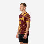 Side view of maroon soccer training jersey showing Athletic Gold marble sublimation print across sleeve and body