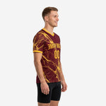 Sleeve detail of maroon soccer training jersey with full Athletic Gold marble dye sublimation print and cuff trim