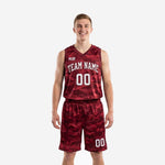 Custom maroon basketball uniforms with digital camo pattern, white arched team name and front number, V-neck sleeveless jersey and matching shorts, front view