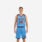 Custom maroon and light blue reversible basketball uniform set front view showing both jersey and matching shorts on male model
