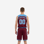 Side view of maroon and light blue reversible basketball uniform showing diagonal slash panel graphic on jersey and shorts