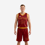 Custom maroon and gold basketball uniforms for men showing full front and back of the sublimated jersey and matching shorts with gold V-neck binding and side stripes
