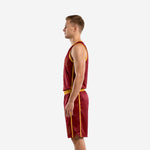 Left side view of maroon and gold men's basketball uniform set showing gold side stripe running from armhole to hem on the jersey and twin gold stripes on the shorts leg