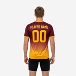 Close-up of chest print zone on maroon soccer training jersey showing team name and player number in Athletic Gold sublimation