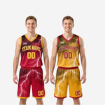 Close-up detail of the white lightning bolt sublimation print on the maroon reversible basketball jersey with gold V-neck and armhole binding trim