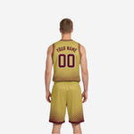 Opposite side view of the custom maroon and gold reversible basketball uniform set showing the full sleeve profile and shorts hem band