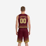 Side view of the maroon and gold reversible basketball uniform set showing armhole binding and shorts side panel construction