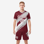 Custom maroon and grey soccer kit with diagonal brush stroke sublimation, front view with team name and number