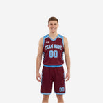 Maroon and light blue reversible basketball uniforms front view showing arched team name and number 00 on maroon side with light blue binding