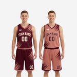 Detail view of the maroon reversible basketball shorts showing diagonal brush-stroke design, elastic waistband with drawcord, and shorts-leg number