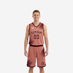 Dusty-rose reverse side of the custom reversible basketball uniform set, with maroon brush-stroke pattern and arced team name printed on jersey and shorts