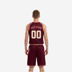 Side view of the maroon reversible basketball uniform jersey showing V-neck binding and armhole trim in dusty rose