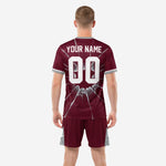 Close detail of maroon sublimated soccer kit with cracked glass graphic and silver panel shorts