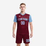 Custom maroon and sky blue soccer kit front view with team name and number, K2 Sportswear
