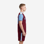 Maroon and sky blue soccer uniform side view showing jersey and matching shorts