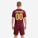 Close detail of geometric cross-hatch sublimation pattern across maroon soccer uniform jersey fabric