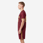 Right side view of custom maroon soccer uniforms with Vegas Gold cuff trim and matching sublimated shorts