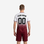 Full-dye sublimated maroon soccer jersey front detail showing dot-burst gradient pattern dissolving from maroon hem to white chest