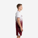 Custom maroon and white dot-burst soccer uniform side view showing V-neck jersey and matching shorts with white side panels