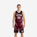 Maroon and white reversible basketball uniforms with lightning sublimation pattern, team name and numbers shown on both the maroon and white sides