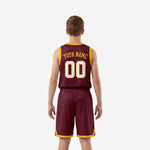 Back view of custom maroon and gold youth basketball uniform showing player name and number placement on the jersey