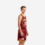 Youth boy wearing custom maroon and gold camo basketball uniform set with lightning crack sublimation design, front view