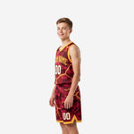 Side view of maroon youth basketball uniform set showing gold V-notch hem on shorts and gold armhole binding on jersey