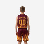 Back view of custom maroon youth basketball jersey and shorts showing player name and number placement with flame detail at hem