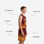 Close detail of gold and orange flame sublimation print on maroon youth basketball uniform jersey showing color depth and print clarity