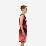 Front view of maroon and coral red custom youth basketball uniform set with arched team name on chest and V-neck collar