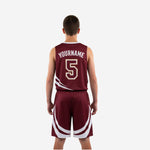 Opposite side view of maroon and white youth basketball uniform displaying sweep jersey stripes and crescent arc shorts design