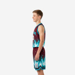 Side view of maroon teal flame youth basketball jersey and matching shorts showing armhole binding and shorts hem trim