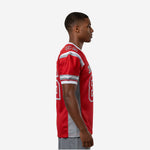 side view of custom red and grey American football jersey showing set-in sleeve stripe bands and grey side panel cut