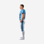 Opposite side view of custom American football uniform set in Columbia blue and white showing jersey side panels and pant stripe detail